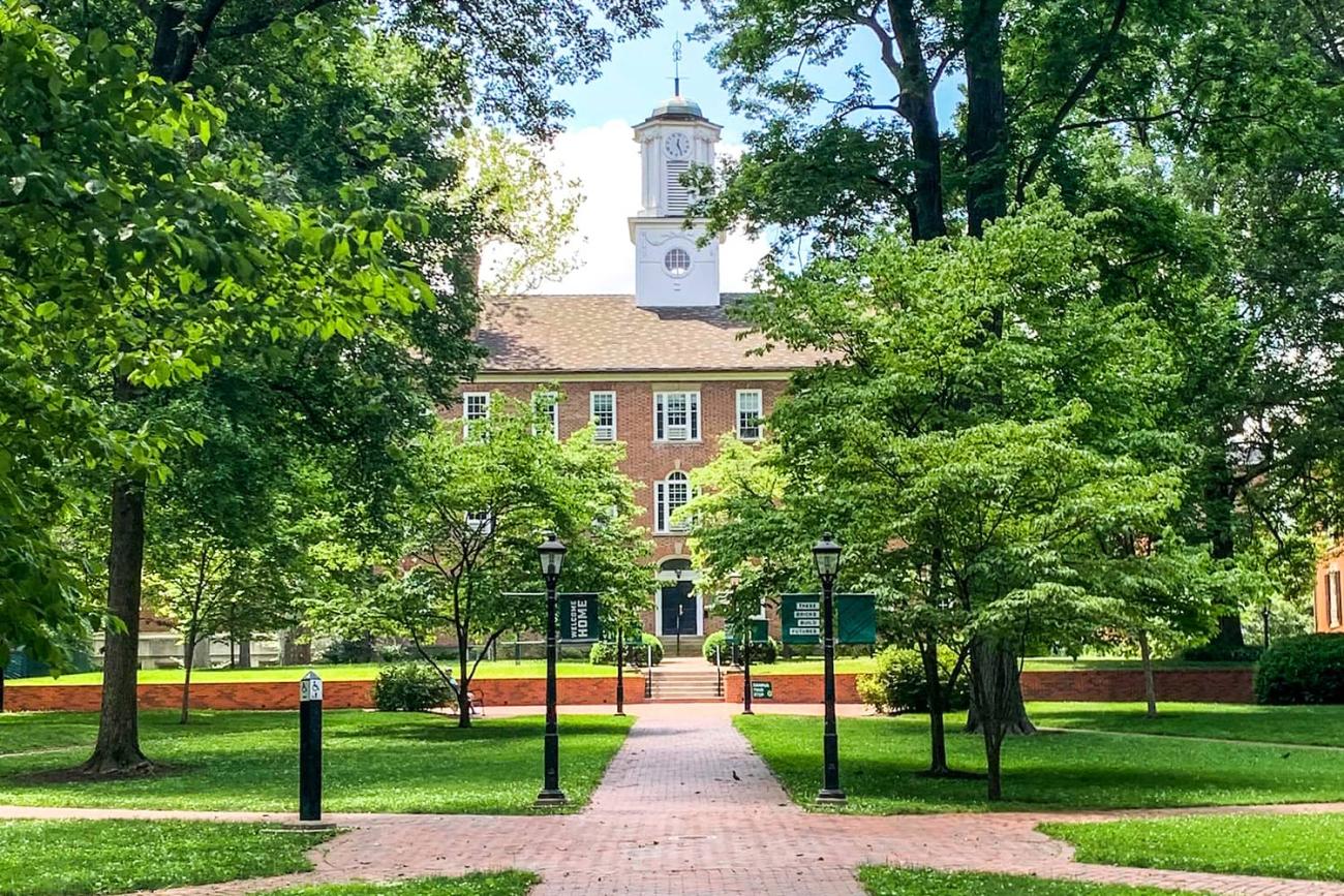 A view of Cutler Hall and College Green on a sunny day.