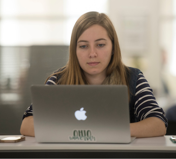 student working on a laptop